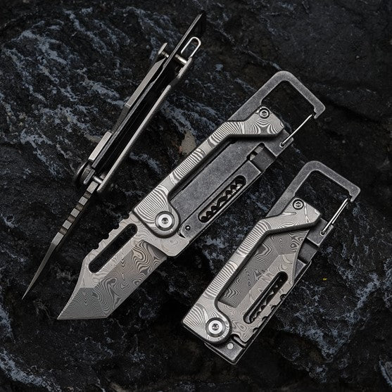 The Dual-Action Blade: 9-in-1 Damascus Keychain Folding Knife